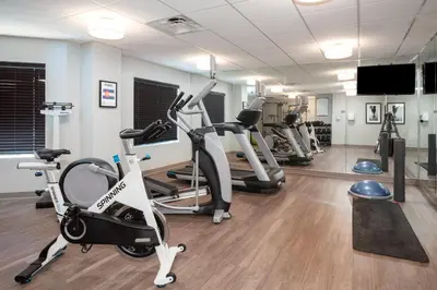 a gym with treadmills and elliptical machines at Staybridge Suites Denver International Airport by IHG in Denver