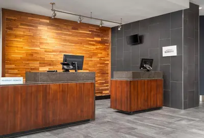 a lobby with a reception desk and a pay phone at Courtyard by Marriott Denver North/Westminster in Eastlake