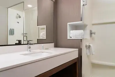 a bathroom with a sink and a mirror at Courtyard by Marriott Denver North/Westminster in Eastlake