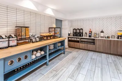 a bakery interior with shelves of food at Staybridge Suites Denver - Cherry Creek by IHG in Denver