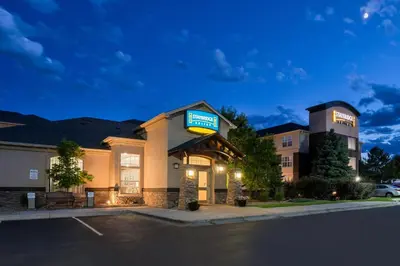 a hotel with a sign that reads hampton inn at Staybridge Suites Denver Tech Center by IHG in Centennial