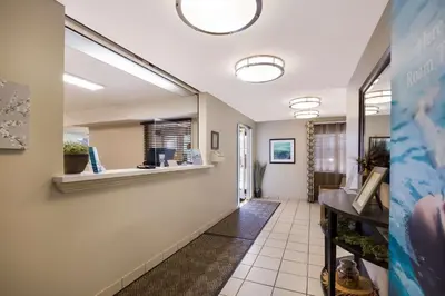 a corridor of a hospital with a waiting room at Sonesta Simply Suites Denver West Federal Center in Lakewood