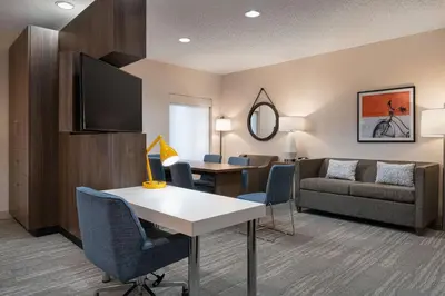 a living room with a couch and a table at Hampton Inn Loveland in Loveland