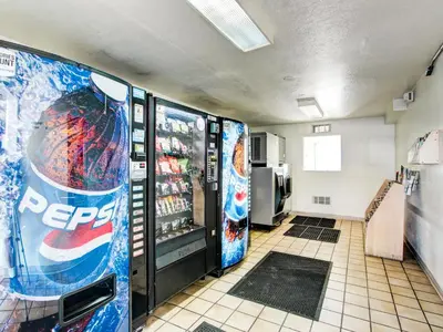 a room with two vending machines in a restaurant at Motel 6-Denver, CO - Airport in Denver