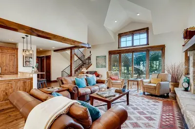 a living room with leather furniture and a fireplace at Keystone Private Homes by Vail Resorts in Keystone