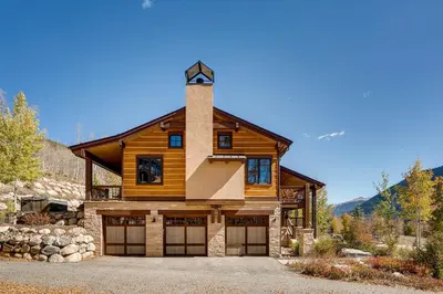 a log home with a tower on top of it at Keystone Private Homes by Vail Resorts in Keystone