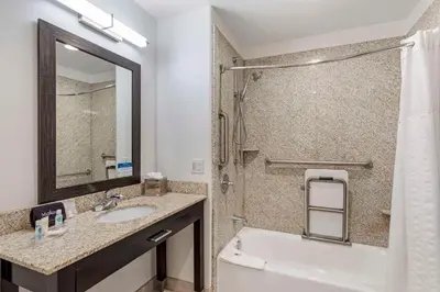 a bathroom with a sink and a toilet and a shower at Comfort Inn & Suites Brighton Denver NE Medical Center in Brighton
