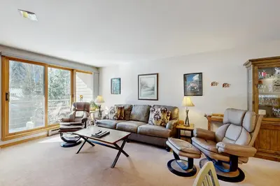 a living room with a couch and a table at Ski Run Condominiums 203 in Keystone