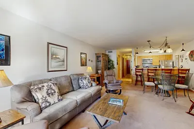 a living room with a couch and a table at Ski Run Condominiums 203 in Keystone