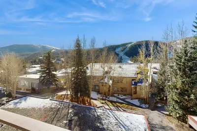 an aerial view of a building in the mountains at Ski Run Condominiums 203 in Keystone
