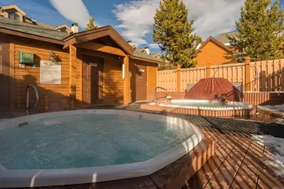 a hot tub in the backyard of a house at Snake River Village 05 in Keystone