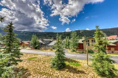 a street in a small town with trees at Snake River Village 05 in Keystone