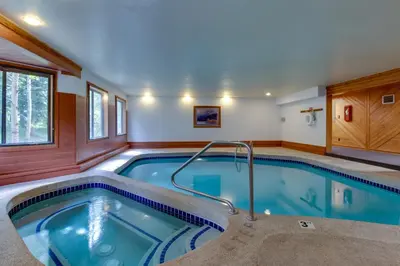 a large swimming pool in a house at Snowdance Manor 205 in Keystone