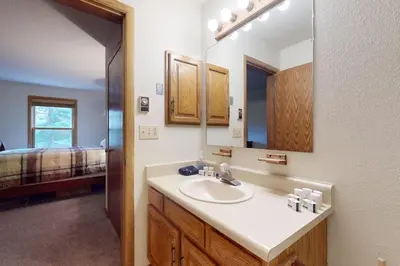 a bathroom with a sink and a mirror at Snowdance Manor 205 in Keystone