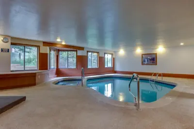a large swimming pool in a house at Snowdance Manor 205 in Keystone