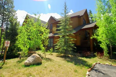 a house with a rock in front of it at Trappers Crossing 8763 in Keystone