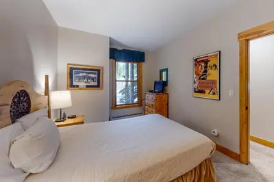 a bedroom with a large bed and a window at Trappers Crossing 8763 in Keystone