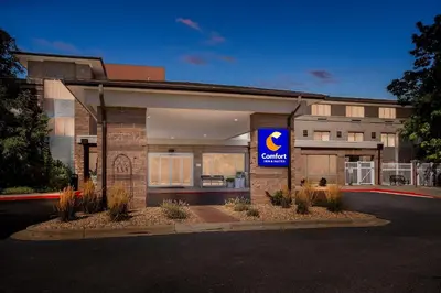 a building with a sign on the front of it at Comfort Inn & Suites Boulder in Boulder