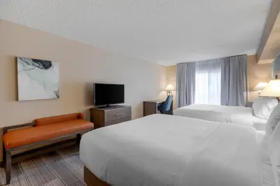 a hotel room with two beds and a television at Comfort Inn & Suites Boulder in Boulder