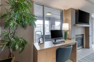 an office with a desk with a computer on it at Comfort Inn & Suites Boulder in Boulder