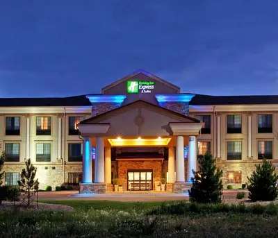 a rendering of the front of a hotel at night at Holiday Inn Express Hotel & Suites Longmont by IHG in Longmont