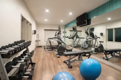 a gym with treadmills and exercise bikes at Holiday Inn Express Hotel & Suites Longmont by IHG in Longmont