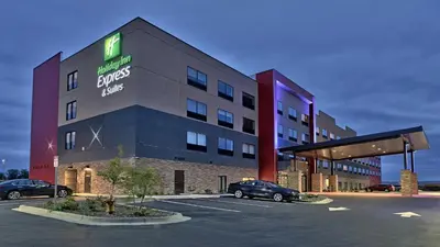 a hotel with a car parked in a parking lot at Holiday Inn Express & Suites Broomfield by IHG in Broomfield