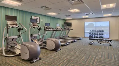 a fitness room with treadmills and cardio machines at Holiday Inn Express & Suites Broomfield by IHG in Broomfield