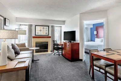a living room with a couch and a room with a bed at Residence Inn Denver North/Westminster in Westminster