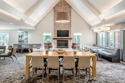 a living room with a wooden table and chairs at Residence Inn Denver North/Westminster in Westminster