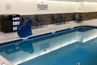 a large swimming pool in a hospital room with chairs at Fairfield Inn by Marriott Denver / Westminster in Westminster