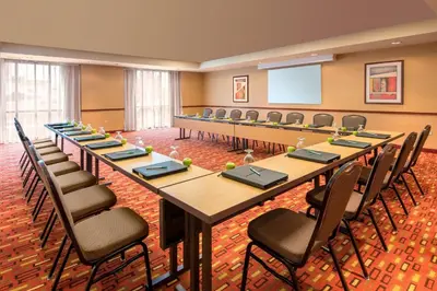 a large conference room with a long table and chairs at Courtyard by Marriott Denver Cherry Creek in Denver