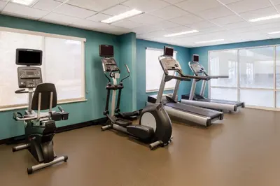 a gym with cardio equipment in a room at Fairfield Inn & Suites by Marriott Denver Aurora/Medical Center in Aurora