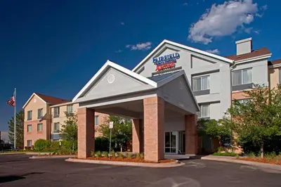 a hotel building with a sign on top of it at Fairfield Inn & Suites by Marriott Denver Aurora/Medical Center in Aurora