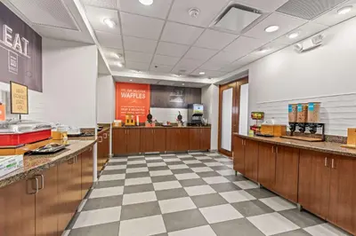 a fast food restaurant with a checkered floor at Hampton Inn Denver Northeast-Brighton in Brighton