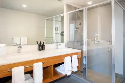 a bathroom with a sink and a shower at Hotel Indigo Denver Downtown - Union Station by IHG in Denver