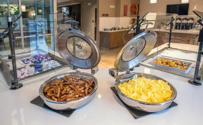three bowls of food sitting on a counter at Staybridge Suites Denver Downtown by IHG in Denver