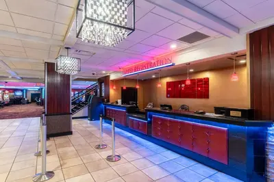 a bar in a restaurant with red and blue at Grand Z Hotel Casino by Red Lion Hotels in Central City