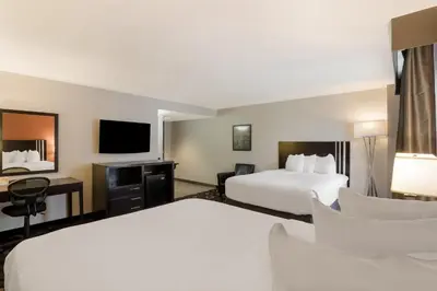 a hotel room with two beds and a flat screen tv at Grand Z Hotel Casino by Red Lion Hotels in Central City