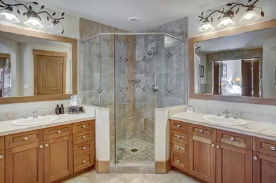 a bathroom with two sinks and a shower at Timbers & Lone Eagle by Vail Resorts in Keystone