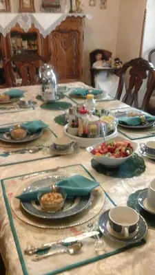 a table with plates of food on top at The Silk Pincushion in Golden
