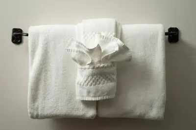 a group of white towels hanging on a towel rack at The Landing at Estes Park in Estes Park