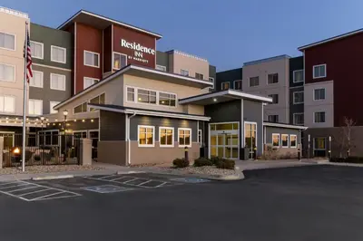 a parking lot in front of a hotel at Residence Inn by Marriott Denver Central Park in Denver