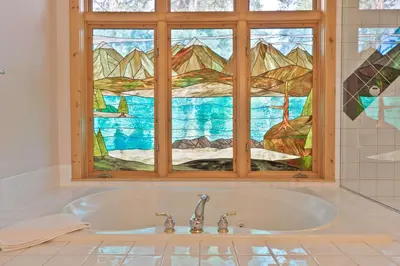 a bath tub in a bathroom with a window at Hohenmark Haus Home: Great Year-Round Location in Breckenridge