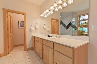 a bathroom with a sink and a large mirror at Hohenmark Haus Home: Great Year-Round Location in Breckenridge