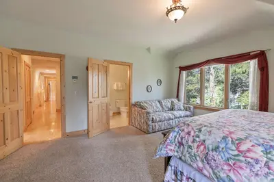 a bedroom with a bed and a couch and a window at Hohenmark Haus Home: Great Year-Round Location in Breckenridge