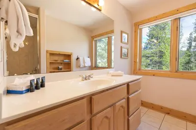 a bathroom with a sink and a mirror at Hohenmark Haus Home: Great Year-Round Location in Breckenridge