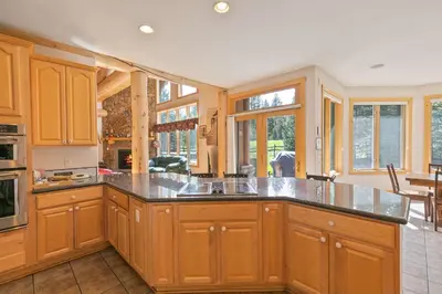 a kitchen with wooden cabinets and a large island at Hohenmark Haus Home: Great Year-Round Location in Breckenridge