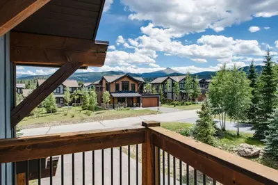a view from the balcony of a house at The Shores Riverside Townhome: Peaceful Luxury in Breckenridge