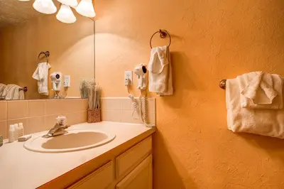 a bathroom with a sink and a mirror at Mountainside Trailview Condo: Cozy Frisco Retreat in Frisco